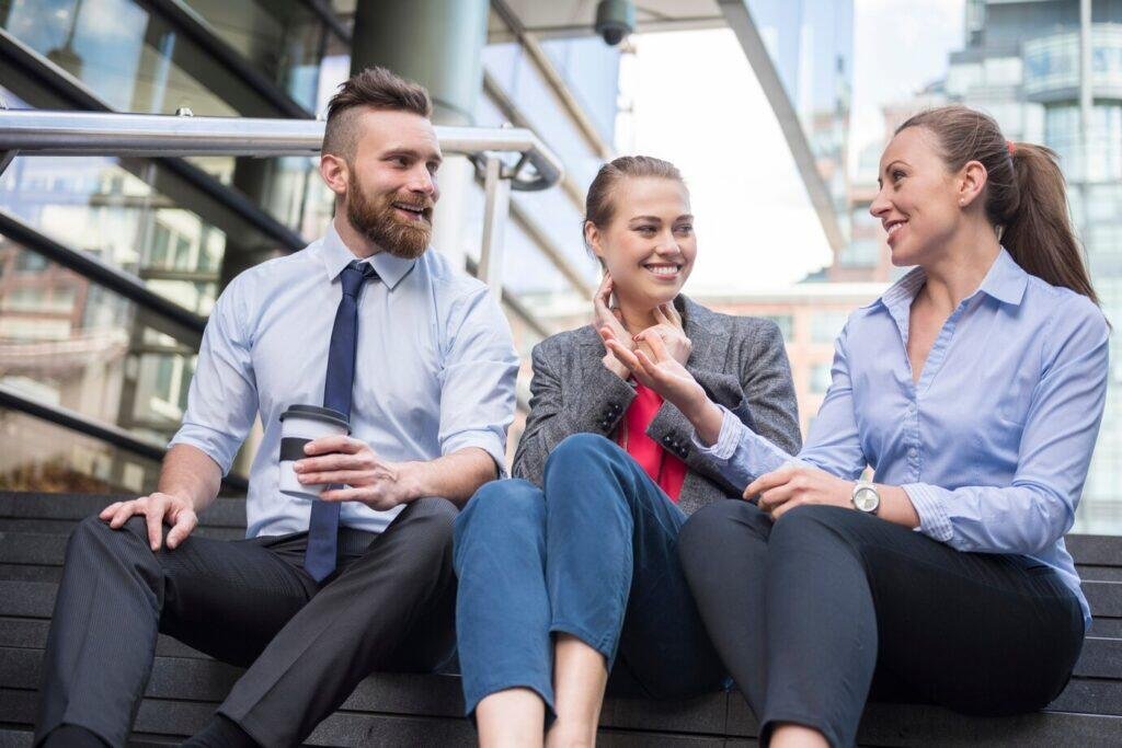 Three Australian business professionals discuss life insurance options.